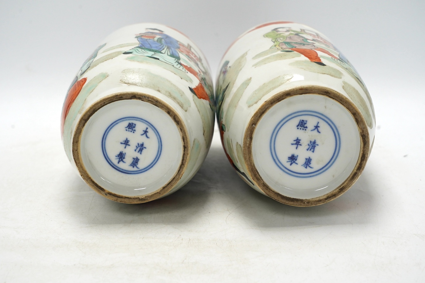 A pair of Chinese famille verte vases, hand painted with figures, 32cm high. Condition - good